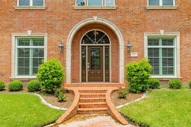 1 Heritage Oak Ct, Lake Jackson, TX 77566 - entrance to property featuring brick siding and a lawn
