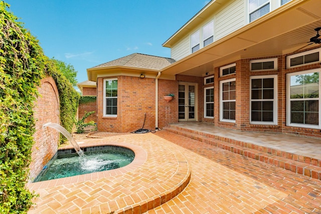 1 Heritage Oak Ct, Lake Jackson, TX 77566 - view of patio / terrace featuring an in-ground hot tub, french doors, and ceiling fan