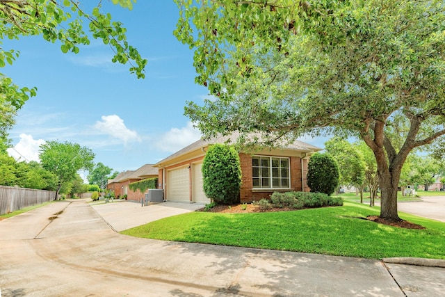 1 Heritage Oak Ct, Lake Jackson, TX 77566 - view of front facade with driveway, brick siding, and a garage