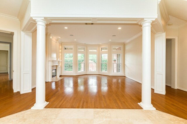 1 Heritage Oak Ct, Lake Jackson, TX 77566 - unfurnished living room featuring wood finished floors, a premium fireplace, recessed lighting, crown molding, and baseboards