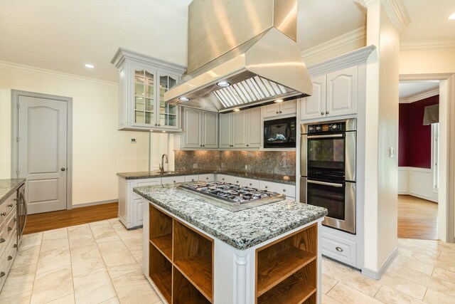 1 Heritage Oak Ct, Lake Jackson, TX 77566 - kitchen featuring open shelves, extractor fan, stainless steel appliances, ornamental molding, and tasteful backsplash