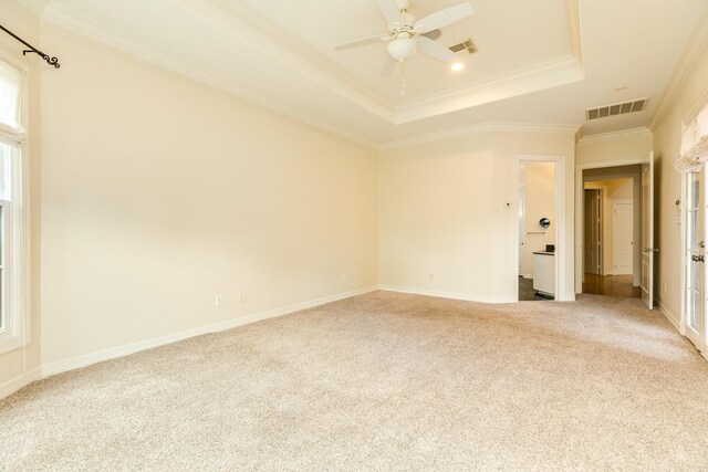 1 Heritage Oak Ct, Lake Jackson, TX 77566 - empty room featuring a raised ceiling, carpet flooring, ceiling fan, crown molding, and baseboards