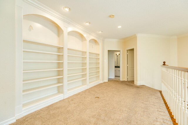 1 Heritage Oak Ct, Lake Jackson, TX 77566 - hall with carpet, crown molding, built in features, recessed lighting, and baseboards