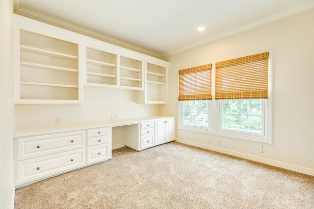 1 Heritage Oak Ct, Lake Jackson, TX 77566 - unfurnished office with built in study area, ornamental molding, light colored carpet, and baseboards