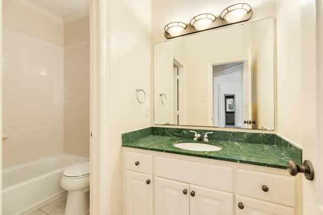 1 Heritage Oak Ct, Lake Jackson, TX 77566 - bathroom featuring crown molding, toilet, tile patterned flooring, vanity, and bathing tub / shower combination
