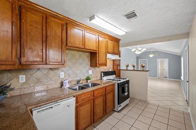2401 Kingsdale Dr, Deer Park, TX 77536 - kitchen with gas range, dishwasher, a sink, under cabinet range hood, and a chandelier