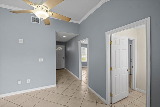 2401 Kingsdale Dr, Deer Park, TX 77536 - empty room with ornamental molding, light tile patterned floors, ceiling fan, and baseboards