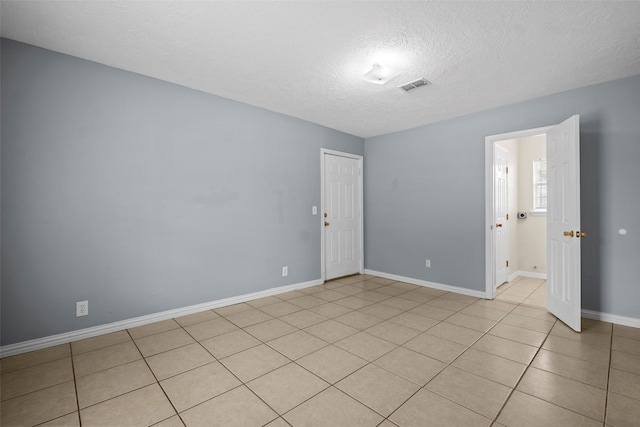 2401 Kingsdale Dr, Deer Park, TX 77536 - spare room with a textured ceiling and baseboards