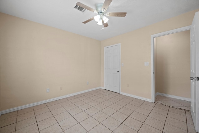 2401 Kingsdale Dr, Deer Park, TX 77536 - empty room with a ceiling fan, baseboards, and light tile patterned floors