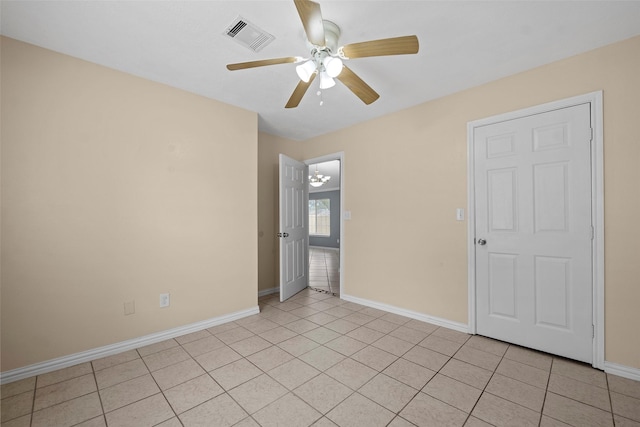 2401 Kingsdale Dr, Deer Park, TX 77536 - spare room with baseboards, ceiling fan, and light tile patterned floors