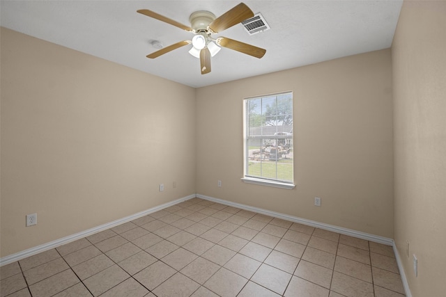 2401 Kingsdale Dr, Deer Park, TX 77536 - unfurnished room with a ceiling fan, baseboards, light tile patterned flooring, and a smoke detector