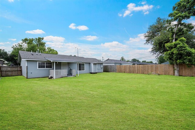 2401 Kingsdale Dr, Deer Park, TX 77536 - rear view of property with a shingled roof