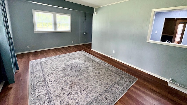 1105 S Main St, Highlands, TX 77562 - spare room with wood finished floors, plenty of natural light, and baseboards