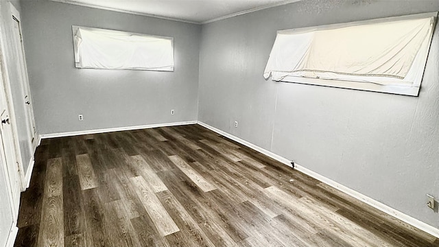 1105 S Main St, Highlands, TX 77562 - unfurnished bedroom featuring wood finished floors, ornamental molding, and baseboards