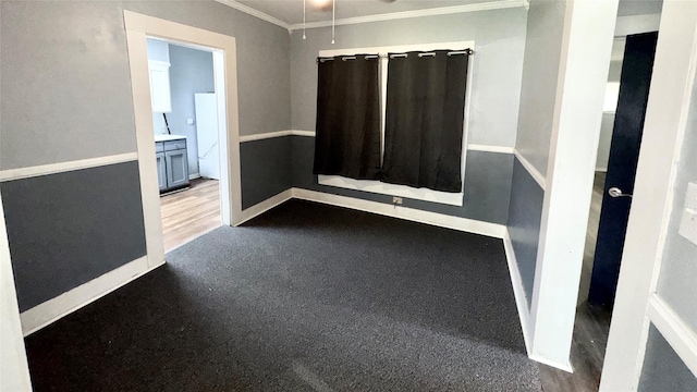 1105 S Main St, Highlands, TX 77562 - empty room with crown molding, baseboards, and ceiling fan