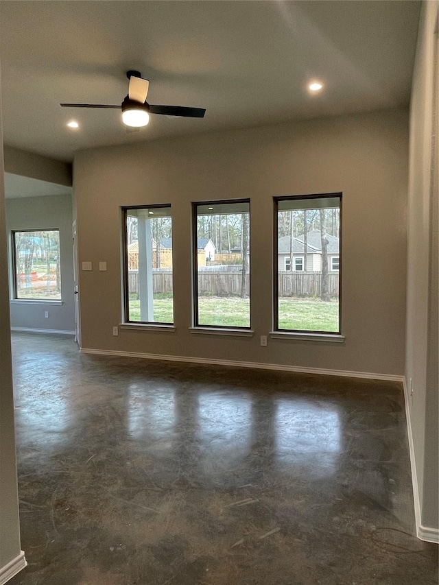 116 Indian Creek Cir, Willis, TX 77378 - spare room featuring baseboards, finished concrete flooring, ceiling fan, and recessed lighting