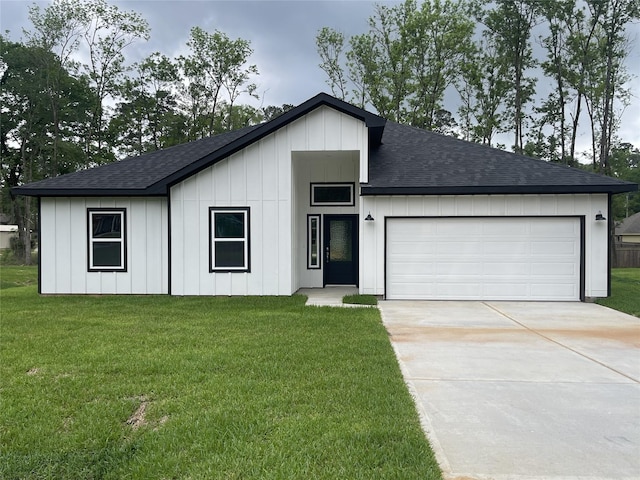 116 Indian Creek Cir, Willis, TX 77378 - view of front of house with roof with shingles, board and batten siding, driveway, and a front yard