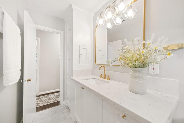 4502 Lido Ln, Houston, TX 77092 - bathroom with vanity, marble finish flooring, a chandelier, baseboards, and crown molding