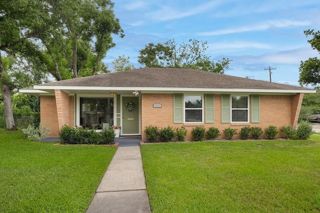 4502 Lido Ln, Houston, TX 77092 - ranch-style house featuring brick siding, a front lawn, and roof with shingles