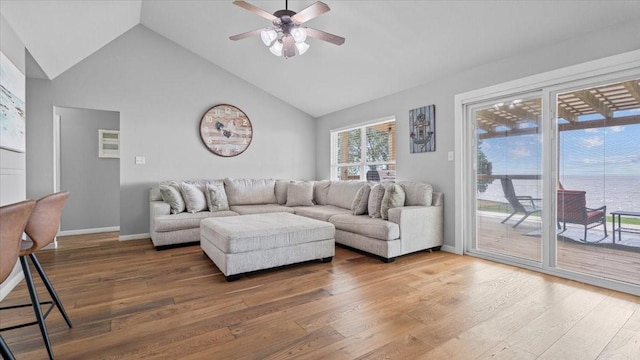281 Fishermans Bend Dr, Point Blank, TX 77364 - living area with wood finished floors, a ceiling fan, high vaulted ceiling, and baseboards
