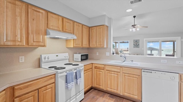 281 Fishermans Bend Dr, Point Blank, TX 77364 - kitchen featuring white appliances, under cabinet range hood, a sink, ceiling fan, and light countertops