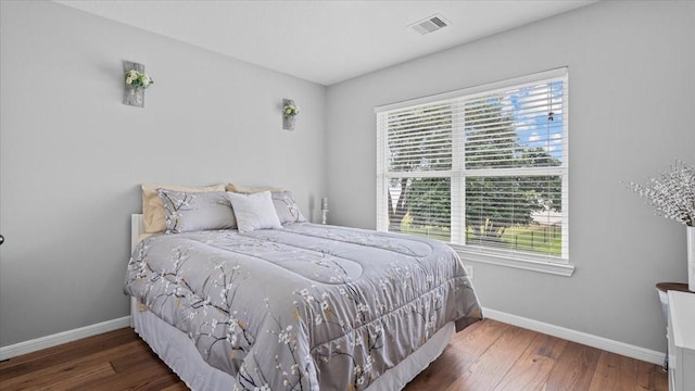 281 Fishermans Bend Dr, Point Blank, TX 77364 - bedroom featuring multiple windows, baseboards, and wood finished floors