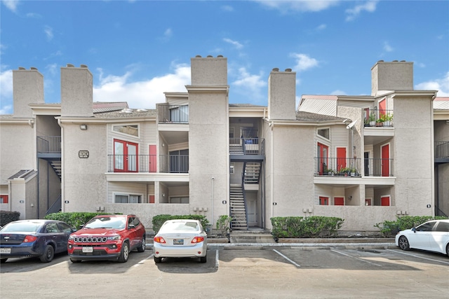 10855 Meadowglen Ln Unit 806, Houston, TX 77042 - view of building exterior featuring uncovered parking