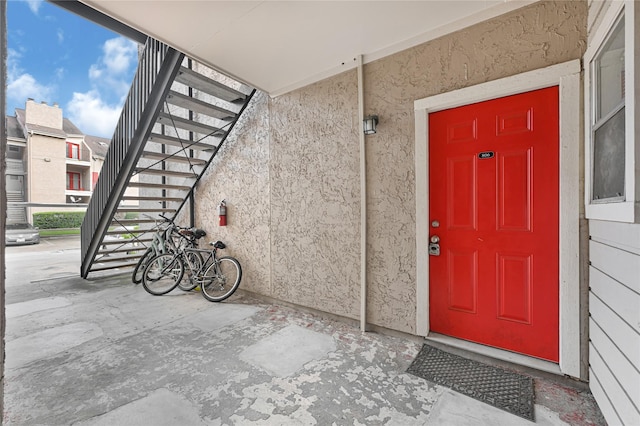10855 Meadowglen Ln Unit 806, Houston, TX 77042 - doorway to property featuring stucco siding