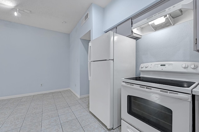 10855 Meadowglen Ln Unit 806, Houston, TX 77042 - kitchen with white appliances, premium range hood, light tile patterned floors, baseboards, and light countertops