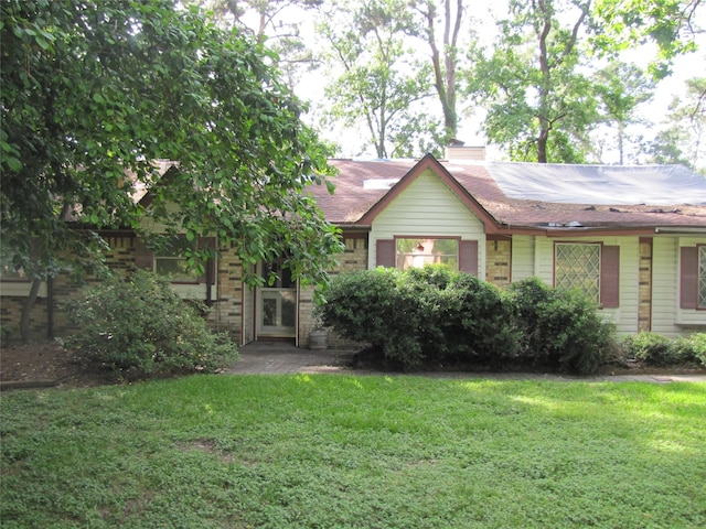 21315 Greengate Dr, Spring, TX 77388 - view of front of home featuring a front lawn and a chimney