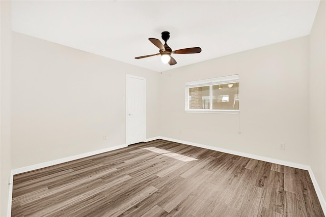 11108 Dawson Rd, Pearland, TX 77584 - spare room featuring wood finished floors, baseboards, and a ceiling fan