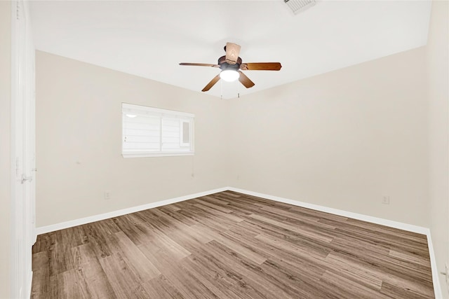 11108 Dawson Rd, Pearland, TX 77584 - empty room featuring wood finished floors, ceiling fan, and baseboards