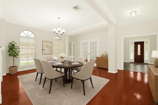11108 Dawson Rd, Pearland, TX 77584 - dining space featuring a chandelier, ornamental molding, dark wood-type flooring, baseboards, and french doors