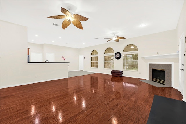 11108 Dawson Rd, Pearland, TX 77584 - unfurnished living room featuring a ceiling fan, wood finished floors, a tile fireplace, baseboards, and recessed lighting