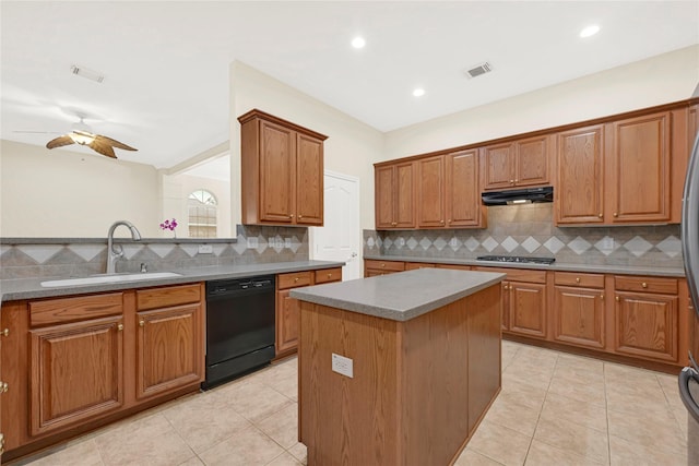 11108 Dawson Rd, Pearland, TX 77584 - kitchen featuring black dishwasher, a sink, under cabinet range hood, tasteful backsplash, and light tile patterned floors