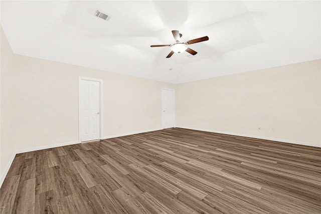 11108 Dawson Rd, Pearland, TX 77584 - empty room with ceiling fan, wood finished floors, baseboards, and vaulted ceiling