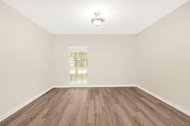 11108 Dawson Rd, Pearland, TX 77584 - unfurnished room with wood finished floors and baseboards