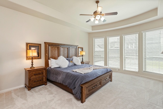 10518 Kicking Horse Pass, Cypress, TX 77433 - bedroom with light carpet, multiple windows, baseboards, and a ceiling fan