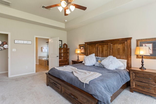 10518 Kicking Horse Pass, Cypress, TX 77433 - bedroom with light colored carpet, baseboards, ensuite bath, and a ceiling fan