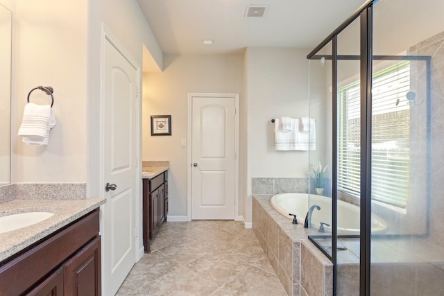 10518 Kicking Horse Pass, Cypress, TX 77433 - full bathroom with two vanities, a garden tub, and a shower stall