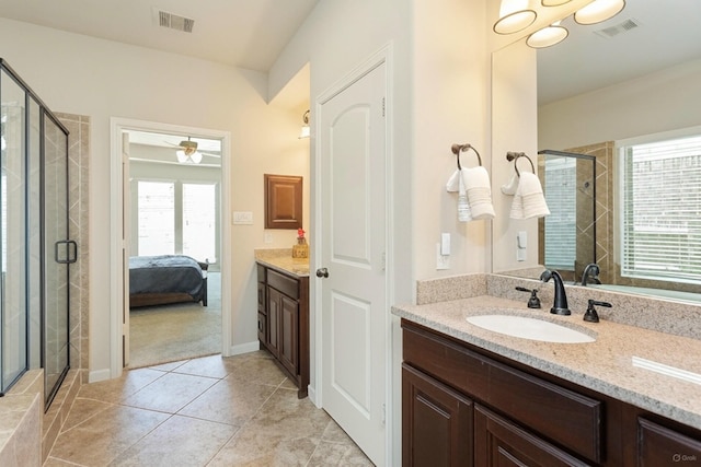 10518 Kicking Horse Pass, Cypress, TX 77433 - ensuite bathroom with vanity, a shower stall, and tile patterned flooring