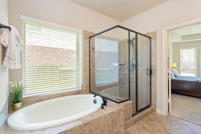 10518 Kicking Horse Pass, Cypress, TX 77433 - bathroom with a bath, connected bathroom, a stall shower, and tile patterned floors