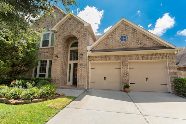 10518 Kicking Horse Pass, Cypress, TX 77433 - traditional home featuring concrete driveway, brick siding, and a garage