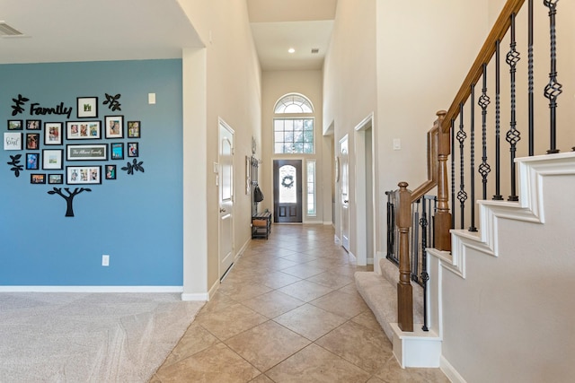 10518 Kicking Horse Pass, Cypress, TX 77433 - foyer with stairway, baseboards, light tile patterned flooring, and a towering ceiling