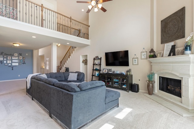 10518 Kicking Horse Pass, Cypress, TX 77433 - carpeted living area featuring ceiling fan, stairway, a high ceiling, baseboards, and recessed lighting