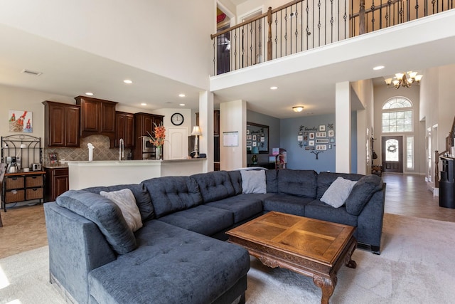10518 Kicking Horse Pass, Cypress, TX 77433 - living area featuring a high ceiling, a chandelier, and recessed lighting