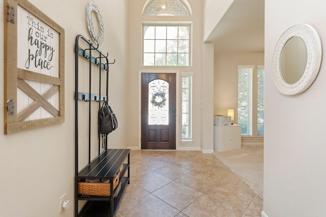 10518 Kicking Horse Pass, Cypress, TX 77433 - carpeted foyer featuring baseboards, tile patterned flooring, and a high ceiling
