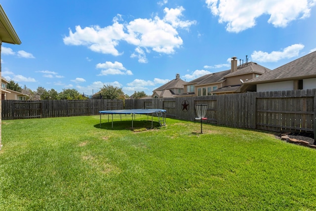 10518 Kicking Horse Pass, Cypress, TX 77433 - view of yard with a trampoline