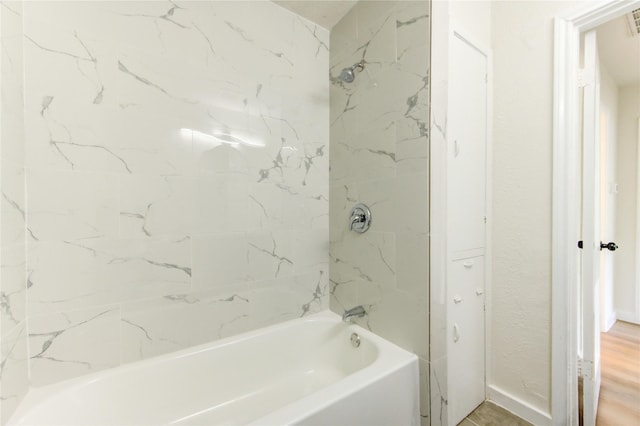 4914 Pershing St, Houston, TX 77033 - full bath featuring tub / shower combination and wood finished floors