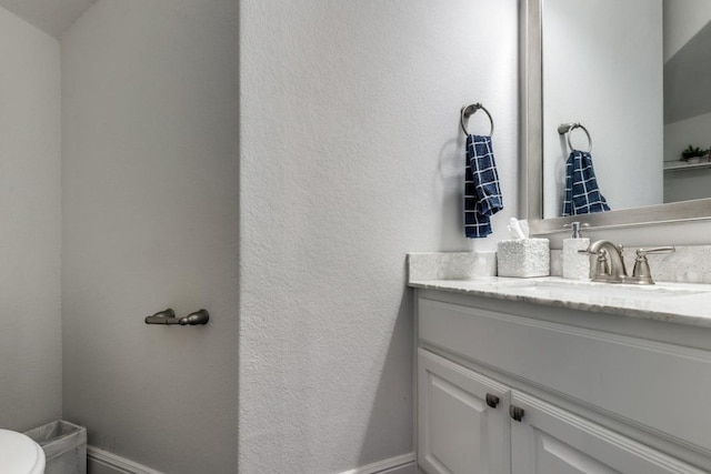 14303 Paseo Marbella Dr, Cypress, TX 77433 - half bathroom featuring vanity, baseboards, toilet, and a textured wall